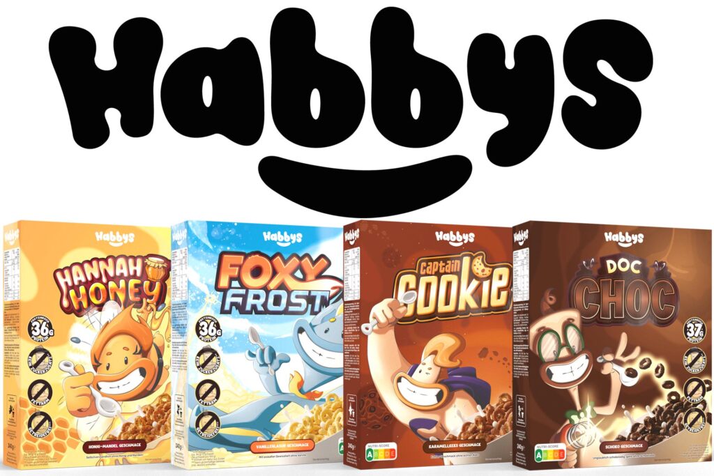 Foto von vier Boxen Habbys Cerealien mit Logo oben mittig, von links nach rechts: Hannah Honey Box, Foxy Frost Box, Captain Cookie Box und Doc Choc Box.